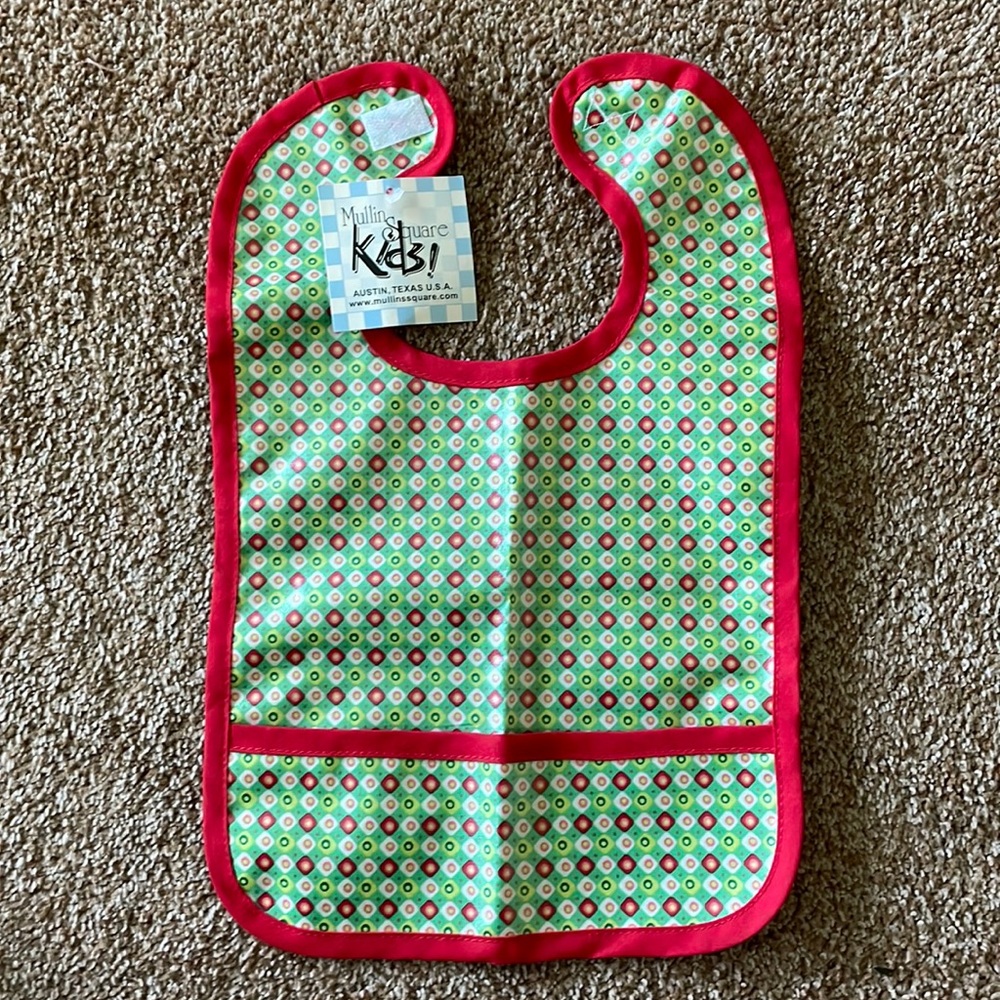 Baby bib with plastic coating on front